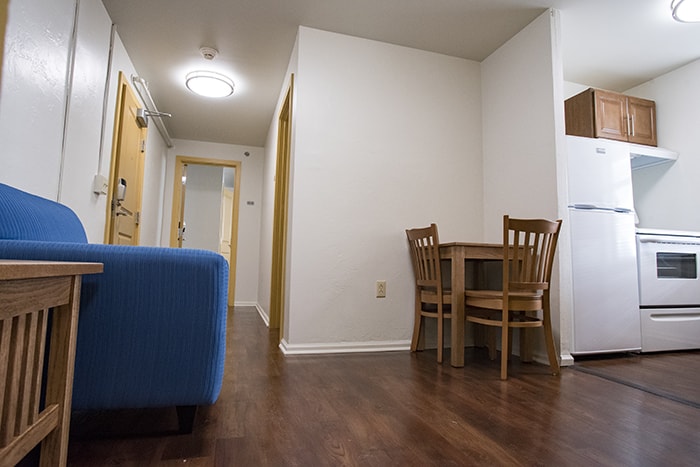 Highlands Apartments Dining and Living Area - small dining table and a couch